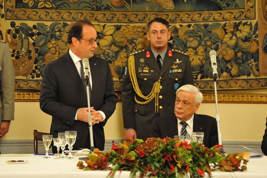 GREECE, Athens: French President Francois Hollande (left) speaks to Hellenic President Prokopis Pavlopoulos at the Presidential Palace in Athens, Greece on October 22, 2015. The reported purpose of Hollande's visit is to explore avenues for debt relief.
