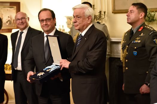 GREECE, Athens: French President Francois Hollande (left) poses with Hellenic President Prokopis Pavlopoulos (center) at the Presidential Palace in Athens, Greece on October 22, 2015 to explore avenues for debt relief.