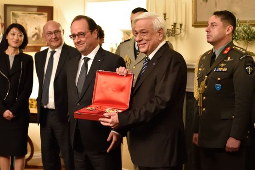 GREECE, Athens: French President Francois Hollande (left) poses with Hellenic President Prokopis Pavlopoulos (center) at the Presidential Palace in Athens, Greece on October 22, 2015 to explore avenues for debt relief.