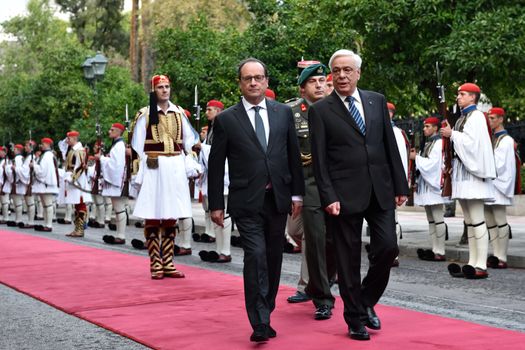GREECE, Athens: French President Francois Hollande (center) visits Hellenic President Prokopis Pavlopoulos (right) at the Presidential Palace in Athens, Greece on October 22, 2015 to explore avenues for debt relief.