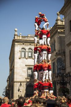 Barcelona, Spain - September 20, 2015: Castelers at La Merce. Human Castle building is a Catalonian tradition and is a UNESCO Masterpiece of the Oral and Intangible Heritage of Humanity