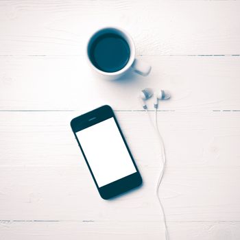 cellphone and coffee cup over white table vintage style