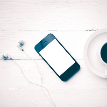 cellphone and coffee cup over white table vintage style