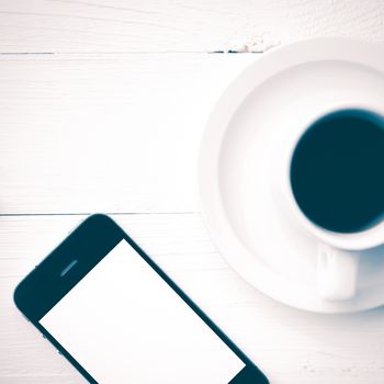 cellphone and coffee cup over white table vintage style