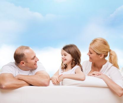 family, childhood and people - smiling mother, father and little girl over blue sky background