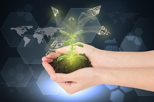 Humans hands holding plant with ground and paper planes on abstract background