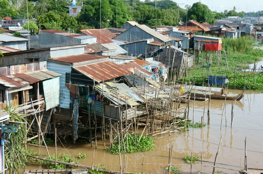 HONG NGU- VIET NAM- OCT 15: Residential on water, group of floating house of poor people on Mekong Delta river, precarious life, danger, home from sheet metal, Hongngu, Vietnam, Oct 15, 2015