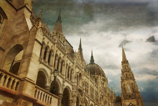 Retro photograph of Hungarian parliament building by Danube river. Budapest, Hungary. Vintage style