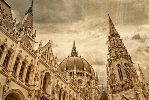 Retro photograph of Hungarian parliament building by Danube river. Budapest, Hungary. Vintage style