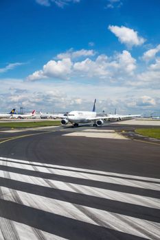 Frankfurt, Germany - May 30, 2013: Runway with several Lufthansa airplanes waiting for clearance to take off. The Frankfurt International Airport is the largest in Germany and the third largest in Europe.