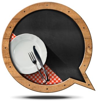 Blackboard with wooden frame in the shape of a speech bubble, empty white plate and silver cutlery. Template for recipes or food menu