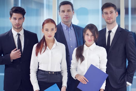 Portrait of business team of men and women indoors