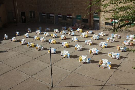 YEMEN, Taiz: A distribution of food and clean water is pictured in the Nasser school, outside Taiz (Ta'izz), western Yemen, on October 23, 2015. Many Yemenis are suffering from lack of basic services and resources, in a humanitarian disaster dramatically worsened by a blockade imposed by the Saudi-led coalition.