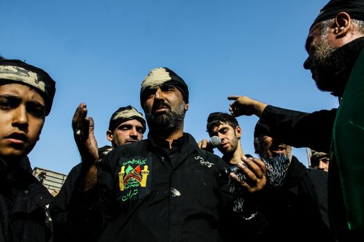 IRAN, Tehran: Iraqis living in Iran gathered to mourn in front of the Grand Bazaar in Tehran, Iran on October 23, 2015.Worshipers in these photos celebrate the Ashura, or tenth day of Muharram. Muharram is the first month in the Islamic calendar and the Ashura marks the day that the grandson of the Prophet Mohammad's grandson, Imam Hussein, was killed. 