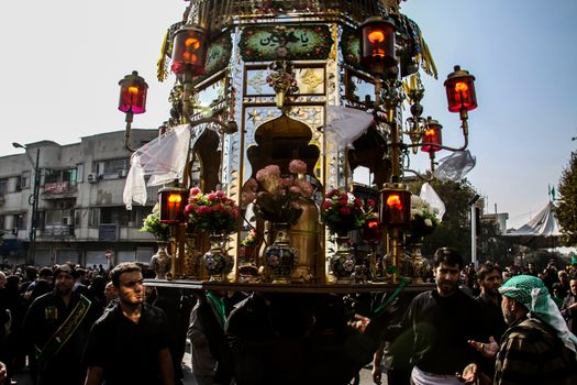 IRAN, Tehran: Iraqis living in Iran gathered to mourn in front of the Grand Bazaar in Tehran, Iran on October 23, 2015.Worshipers in these photos celebrate the Ashura, or tenth day of Muharram. Muharram is the first month in the Islamic calendar and the Ashura marks the day that the grandson of the Prophet Mohammad's grandson, Imam Hussein, was killed. 