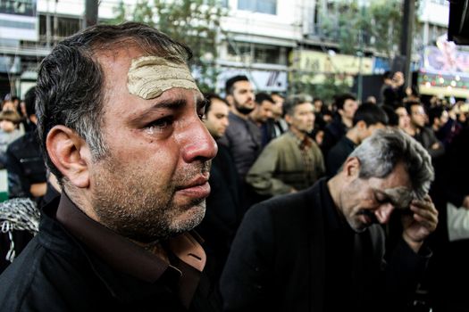 IRAN, Tehran: Iraqis living in Iran gathered to mourn in front of the Grand Bazaar in Tehran, Iran on October 23, 2015.Worshipers in these photos celebrate the Ashura, or tenth day of Muharram. Muharram is the first month in the Islamic calendar and the Ashura marks the day that the grandson of the Prophet Mohammad's grandson, Imam Hussein, was killed. 
