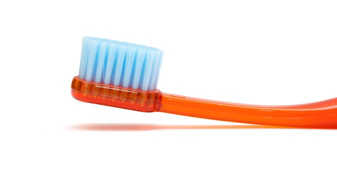 Red toothbrush isolated on a white background