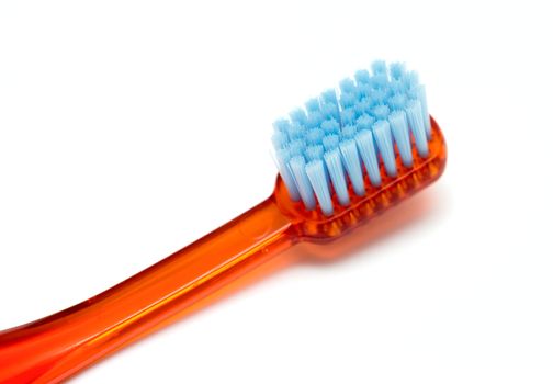 Red toothbrush isolated on a white background