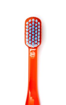 Red toothbrush isolated on a white background
