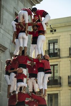 Barcelona, Spain - September 20, 2015: Castelers at La Merce. Human Castle building is a Catalonian tradition and is a UNESCO Masterpiece of the Oral and Intangible Heritage of Humanity