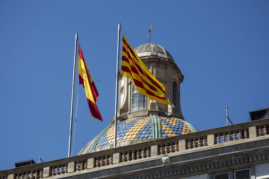 Catalonia Flags flying on top of Palau de la Generalitat , the seat of the Catalan government building