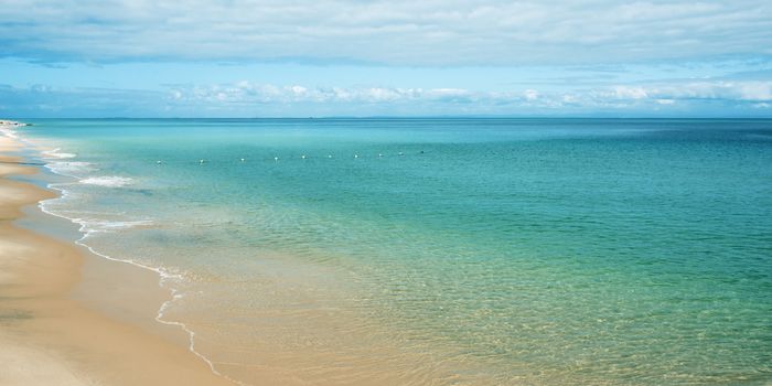 View from Tangalooma Island beach during the day with an overcast sky