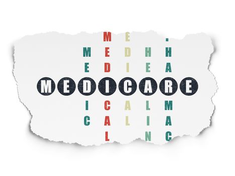 Healthcare concept: Painted black word Medicare in solving Crossword Puzzle on Torn Paper background