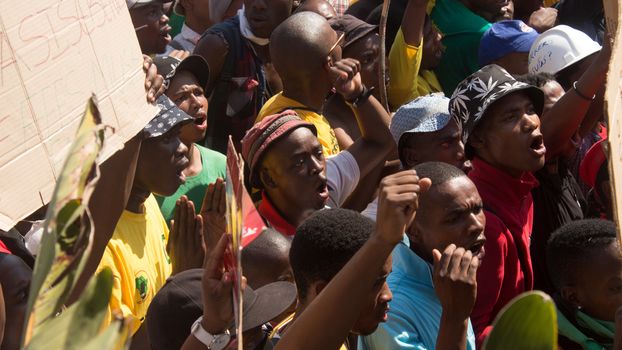 SOUTH AFRICA, Pretoria: Demonstrators run from police as an estimated 10,000 people gather at the Union Buildings on October 23, 2015.  The protesters demand that proposed tuition fee rises be scrapped, and called for the president, Jacob Zuma, to personally address their concerns.  It was the largest student protest since the 1976 Soweto uprising, a significant moment in the fight against South Africa's apartheid regime. 
