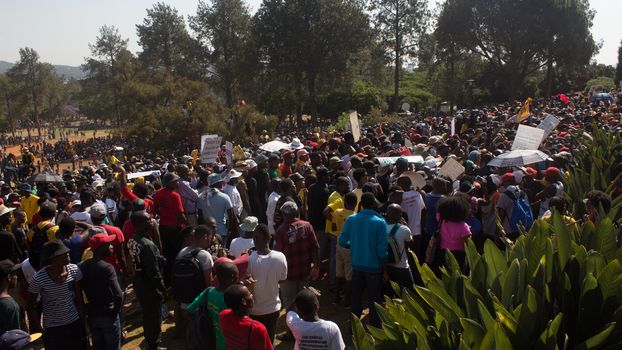 SOUTH AFRICA, Pretoria: Demonstrators run from police as an estimated 10,000 people gather at the Union Buildings on October 23, 2015.  The protesters demand that proposed tuition fee rises be scrapped, and called for the president, Jacob Zuma, to personally address their concerns.  It was the largest student protest since the 1976 Soweto uprising, a significant moment in the fight against South Africa's apartheid regime. 