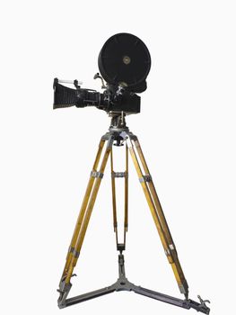 Old movie camera on a tripod isolated on white