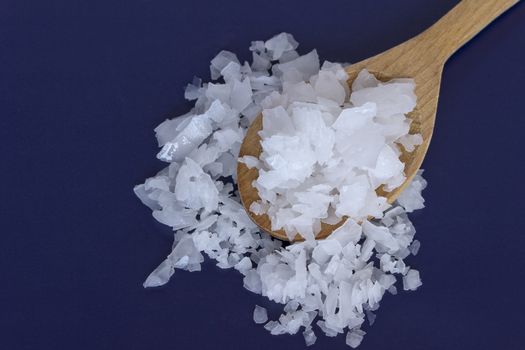 Magnesium chloride -sea salt in wooden spoons-close up