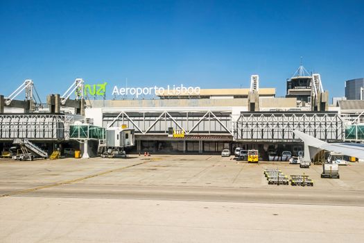 Lisbon, Portugal - May 30, 2013: At the airport of lisbon (Aeroporto Lisboa) after landing. Main gate with tower.