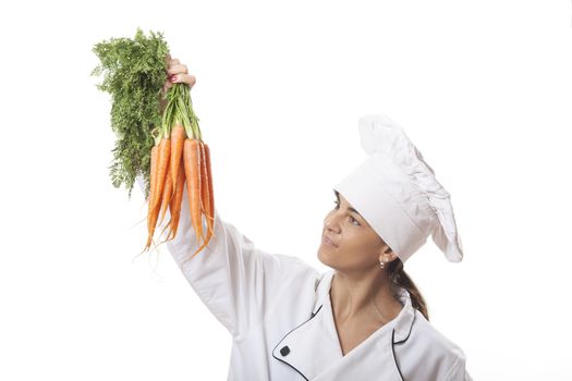 female chef with carrots on white