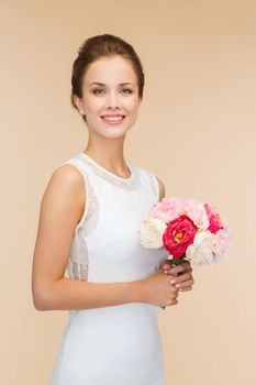 happiness, wedding, holidays and celebration concept - smiling bride or bridesmaid in white dress with bouquet of flowers