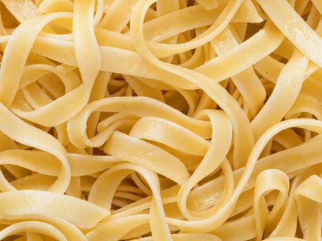 close up of cooked italian fettuccine pasta food background