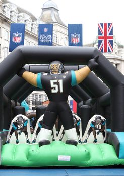UNITED KINGDOM, London: Thousands of fans take part in the American football festivities on October 24, 2015 before the regular-season NFL game between the Bills and the Jaguars is played at Wembley Stadium.  The NFL has been holding regular-season games in London since 2007, typically including an 'NFL on Regent Street' event the day before the game. 