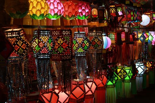 A streetside shop in India displaying different traditional and modern sky lanterns to be used traditionally for Diwali festival in India.