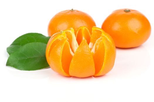 orange mandarins with green leaf isolated on white background