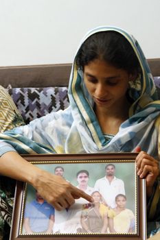 PAKISTAN, Karachi: A 23-year-old Indian woman, who inadvertently crossed the border into Pakistan when she was 11 years old, prepares to return home on October 25, 2015. Geeta, who is deaf and mute, lost her family and has lived in a home for abandoned children run by the Edhi foundation in Karachi.  Her family have been traced in India and she will be reunited with them after a DNA test has been done.