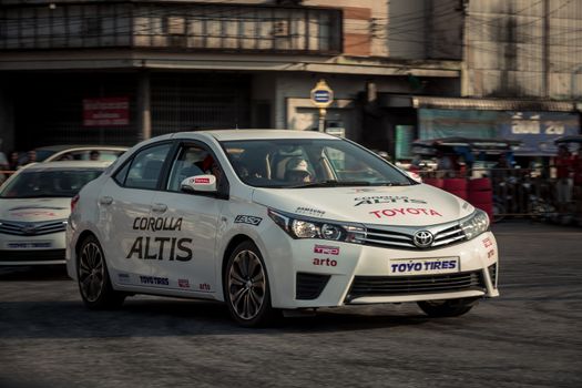 Udon Thani, Thailand - October 18, 2015: Toyota Colora Altis perform drifting on the track at the event Toyota Motor Sport show at Udon Thani, Thailand with motion blur in the background. The cars are drive by drivers from Toyota teams Thailand