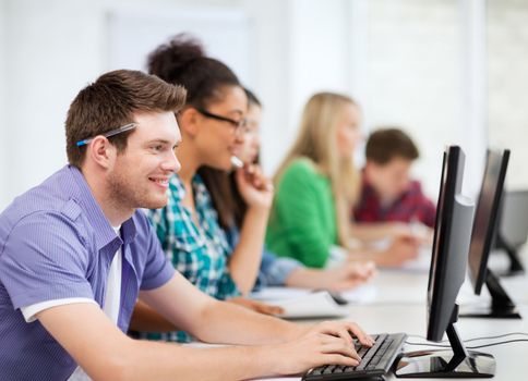 education concept - student with computers studying at school