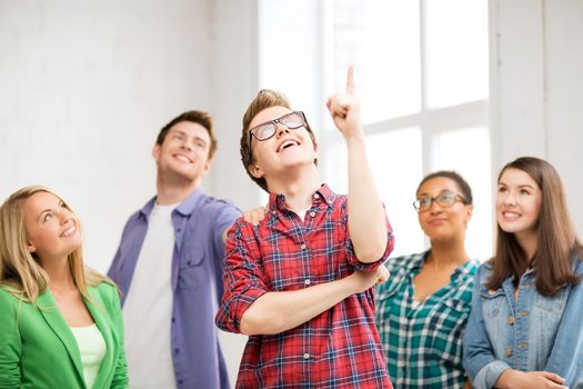 education concept - student boy with group of students at school