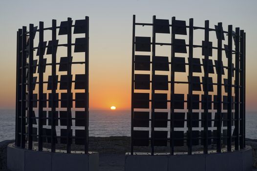 AUSTRALIA, Sydney: The Sculpture by the Sea exhibition in Sydney is photographed here on October 26, 2015 as the sun rises. The sculptures can be seen between Bondi and Tamarama and runs from October 22 to November 8, 2015. Artist: Matthew Asimakis, Clarence Lee & Caitlin Roseby- Half Gate