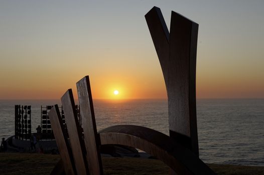 AUSTRALIA, Sydney: The Sculpture by the Sea exhibition in Sydney is photographed here on October 26, 2015 as the sun rises. The sculptures can be seen between Bondi and Tamarama and runs from October 22 to November 8, 2015. Artist: Linda Bowden - The Bridge