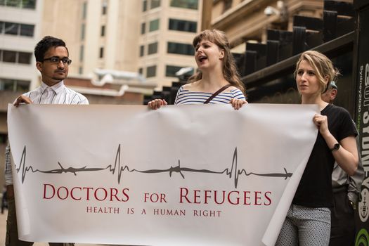 AUSTRALIA, Sydney: Members of Doctors for Refugees are among supporters of a Somali refugee known as Abyan rally in her defence at Town Hall Square in Sydney on October 23, 2015. After allegedly being raped at Nauru detention center, Abyan was flown to Australia to have an abortion, which she was then reportedly denied before being deported back to Nauru. Immigration Minister Peter Dutton has said that Abyan changed her mind about the abortion, and upon her request could be flown back to Australia for the procedure.