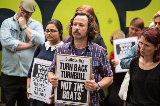 AUSTRALIA, Sydney: Supporters of a Somali refugee known as Abyan rally in her defence at Town Hall Square in Sydney on October 23, 2015. After allegedly being raped at Nauru detention center, Abyan was flown to Australia to have an abortion, which she was then reportedly denied before being deported back to Nauru. Immigration Minister Peter Dutton has said that Abyan changed her mind about the abortion, and upon her request could be flown back to Australia for the procedure.