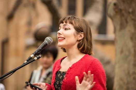 AUSTRALIA, Sydney: Feminist activist and commentator Meg Clement-Couzner addresses supporters of a Somali refugee known as Abyan during a rally at Town Hall Square in Sydney on October 23, 2015. After allegedly being raped at Nauru detention center, Abyan was flown to Australia to have an abortion, which she was then reportedly denied before being deported back to Nauru. Immigration Minister Peter Dutton has said that Abyan changed her mind about the abortion, and upon her request could be flown back to Australia for the procedure.