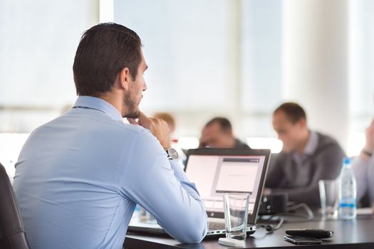 Corporate business meeting in office. Business executive giving instructions to his colleagues. Explaining business plans to employees. Business team concept. Business and Entrepreneurship. 