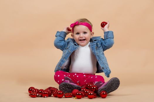 portrait of young cute baby on beige background