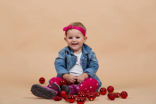 portrait of young cute baby on beige background